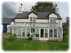 This glass conservatory captures the sun's heat and warms this farmhouse in Wales. Image: Bry Lynas