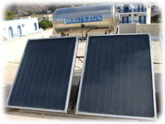 Solar hot water panels on a hotel roof in Greece. Image: Wikipedia